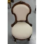 Victorian mahogany framed Nursing Chair, beige upholstered back and seat, on cab legs, porcelain