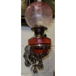 Pair of good quality brass oil lamp wall sconces, with red glass lamp bowls (electrified), (brass