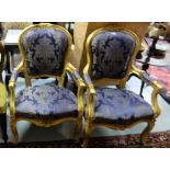 Matching Pair of gilt decorated Armchairs, with curved top rails, on cabriole legs, blue floral