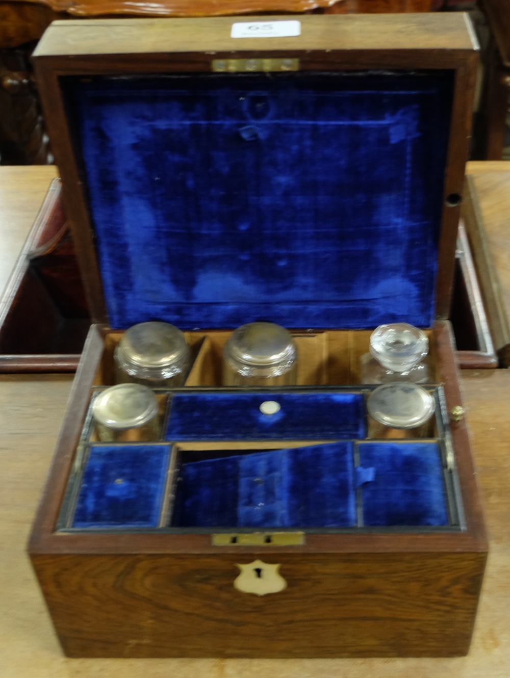 Edw. Rosewood Cased Travelling Cosmetic Box, the blue velvet lined interior fitted with perfume &