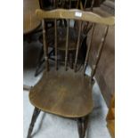 Set of 6 walnut kitchen chairs with spindle backs, on turned legs.