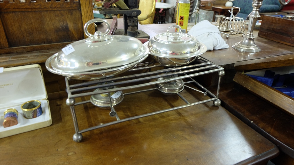 Vic. Sl Pl. Warming Stand with paraffin burners and two oval entrée dishes with lids.