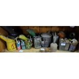 Shelf of small sized oil cans, Shell, Singer etc