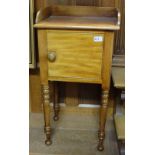 Three similar mahogany bedside cabinets, with single doors, on turned legs.