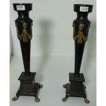 Matching pair reproduction metal table candlesticks, with figural brass mounts, paw feet, 21”h
