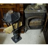 Small cast iron stove, on raised legs (glass door damaged) 22”h x 16”w & black metal outdoor