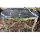 French Coffee Table, the shaped black marble top over a cream painted base, 40”w