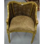 Carved Gilt Salon Armchair, with bergere back and sides, on turned front legs, loose feather