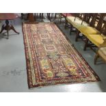 Hand woven Turkish Village Runner Rug, red ground with multiple patterned borders, 310 x 130