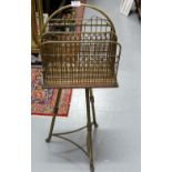 Edw. Brass newspaper rack with carrying handle, on a circular 3-legged brass base, 37”h