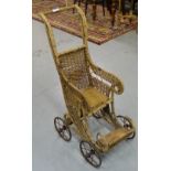19thC wicker child’s stroller, on metal wheels.
