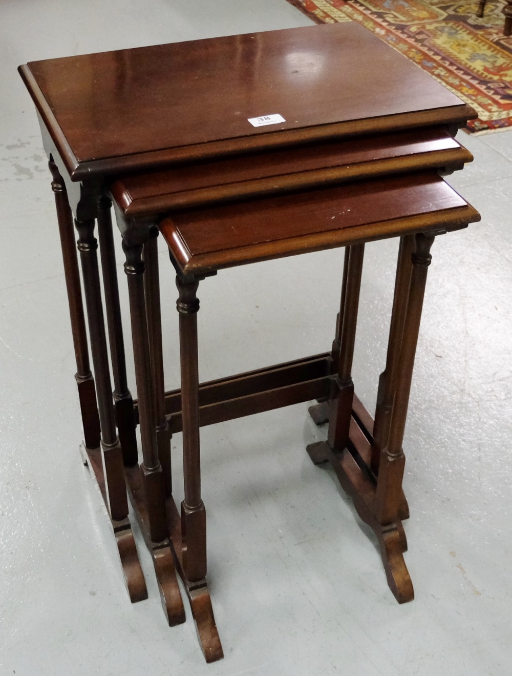 Nest of 3 mahogany Tables, in spindle legs (19” widest)