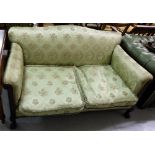 Mahogany framed Sofa, covered with green floral fabric, two feather cushioned seats, on lions paw