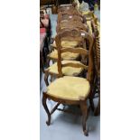 Set of 6 French Oak Dining Chairs, with shaped ladder backs, on sabre feet, rush seats.