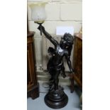 Bronze Floor Lamp, in the form of a cherub with an outstretched arm, electric, with shade (working),