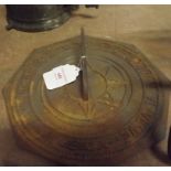 Cast iron octagonal sun dial.