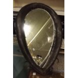 Unusual mirror inset into a leather donk