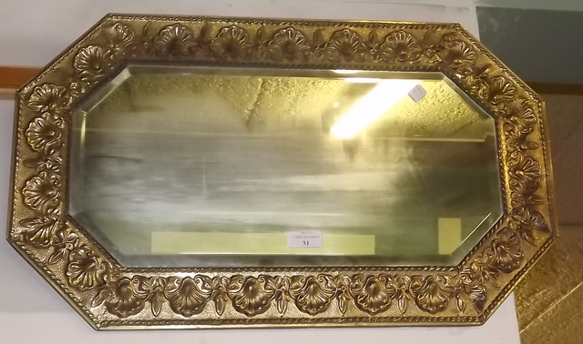 Brass bevel edged wall mirror.