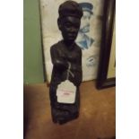 Carved betook wood figure of an African