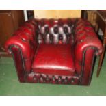 Deep button ox blood leather club chair.