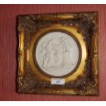 Plaque mounted in a gilt frame. {  28 cm