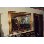 Rectangular gilt framed wall mirror. { 9