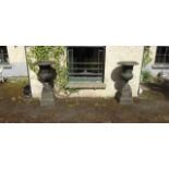 Large pair of cast iron garden urns on s