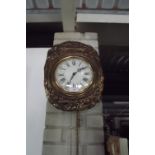 French embossed brass wall clock with en