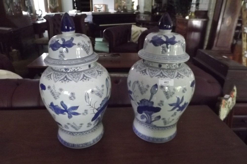 Pair of blue and white lidded jars. { 46