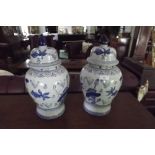 Pair of blue and white lidded jars. { 46