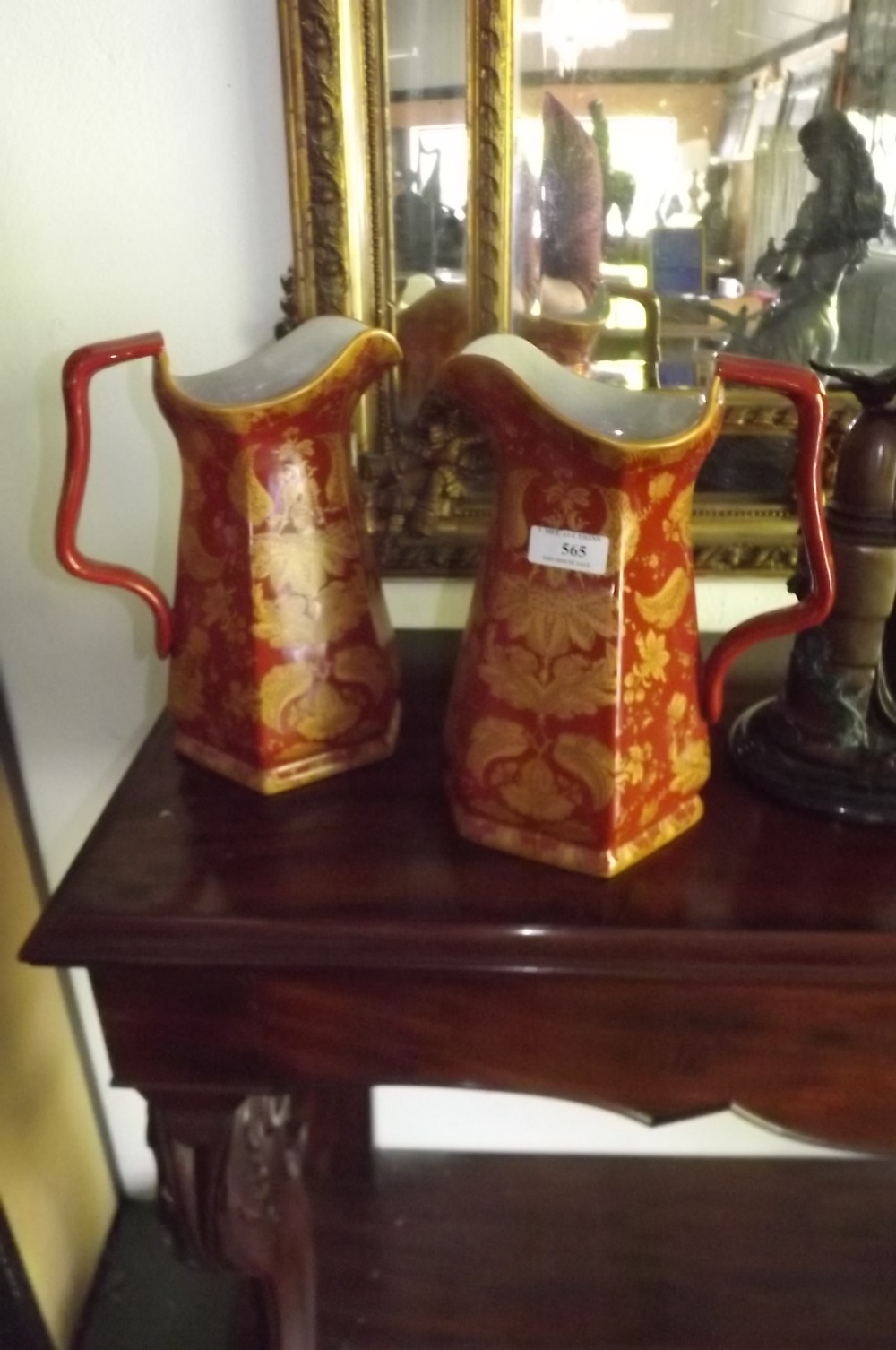 Pair of ceramic jugs with floral decorat
