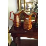 Pair of ceramic jugs with floral decorat