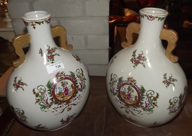 Pair of floral decorated ceramic vases.