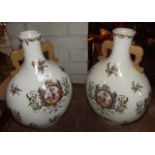 Pair of floral decorated ceramic vases.