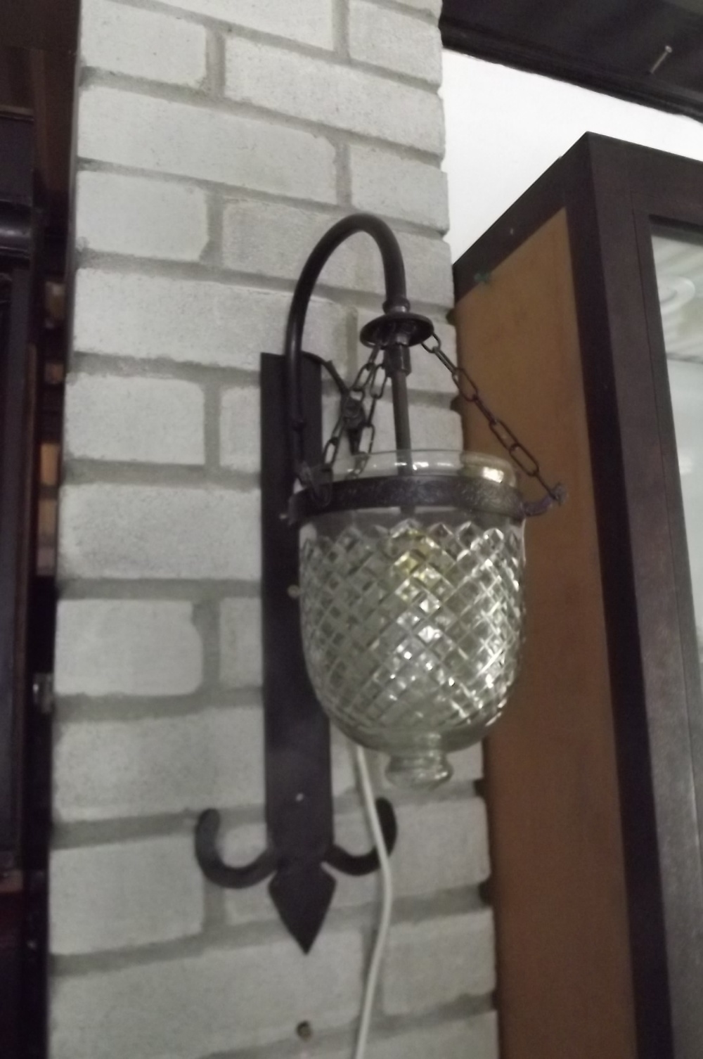 Metal and glass hanging wall light. {  3