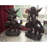 Pair of bronze cherubs with musical inst