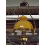 Victorian brass hanging lamp with ocre s