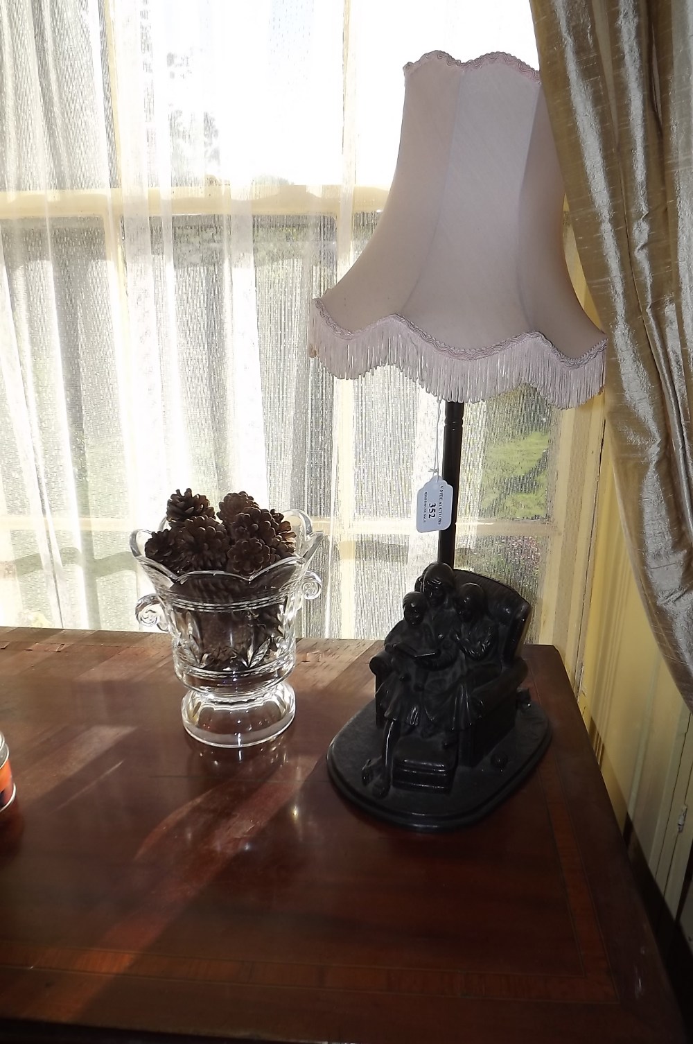 Bronzed table lamp and a moulded glass v