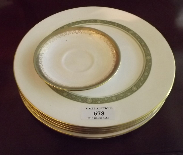 Five Royal Doulton gilt edged plates.
