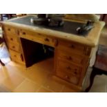 Carved pine desk with leather inset top.