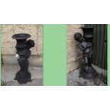 Pair of cast iron planters in the form o