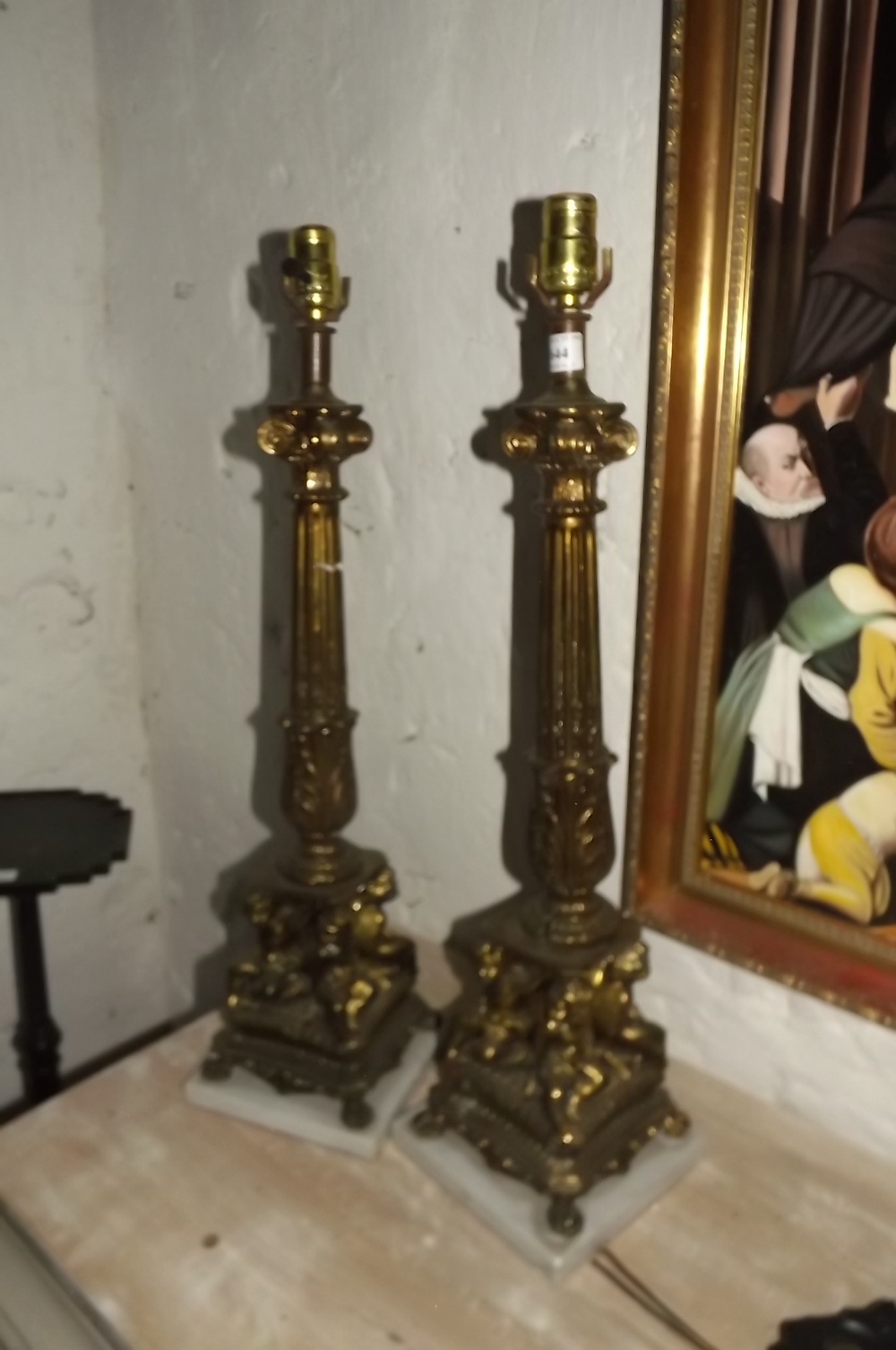 Pair gilded table lamps on marble Base.