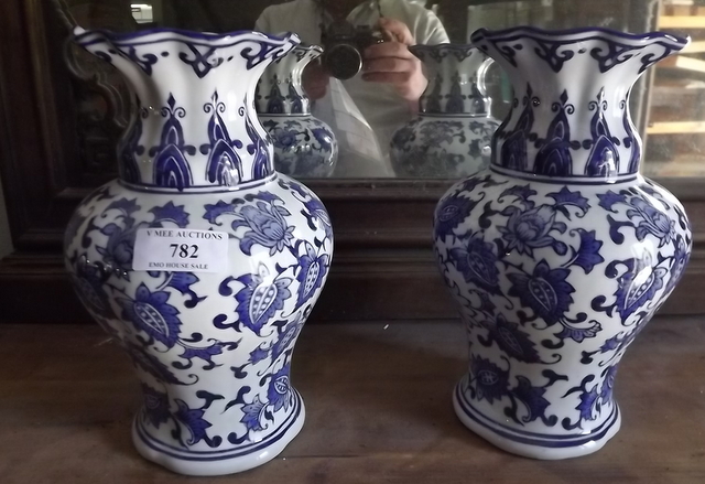 Pair of blue and white vases. {  26 cm H