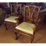 Pair of carved mahogany armchairs.