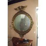 Gilt wood circular pier mirror flanked b