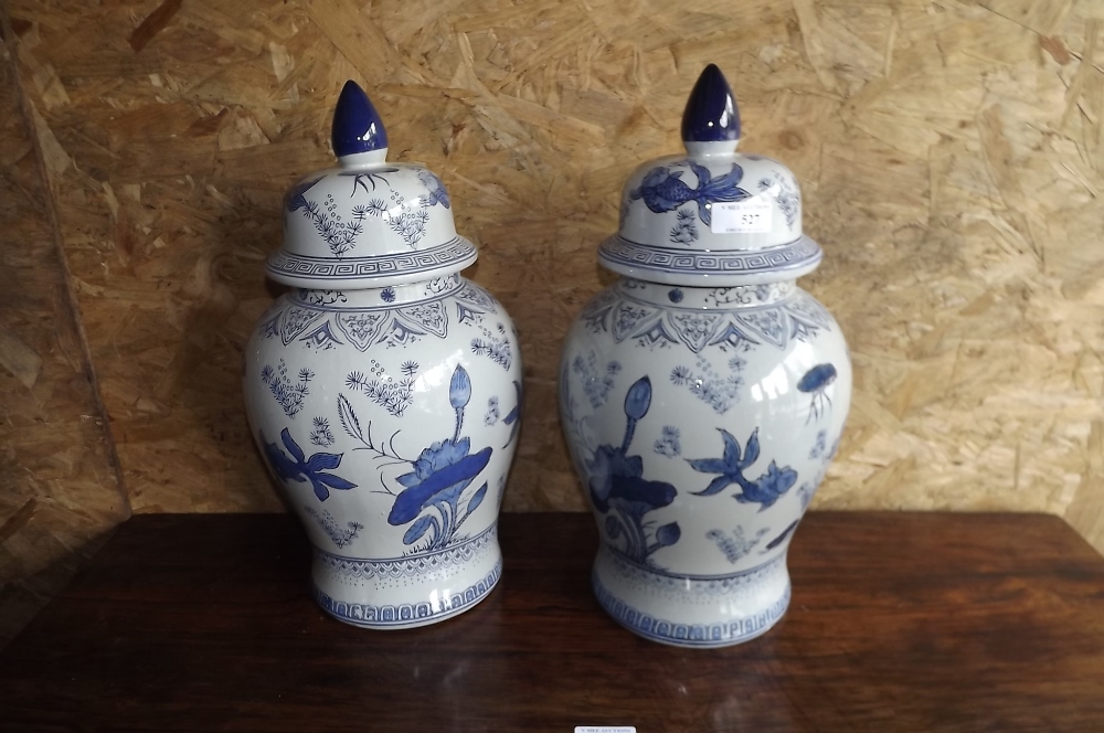 Pair of blue and white lidded jars. {  4