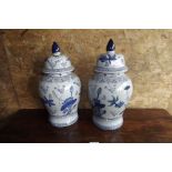 Pair of blue and white lidded jars. {  4