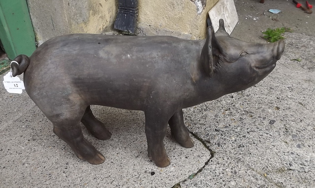 Bronze model of a pig.