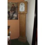 Pine long cased clock with arched rollin