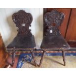 Pair of Victorian oak hall chairs with l